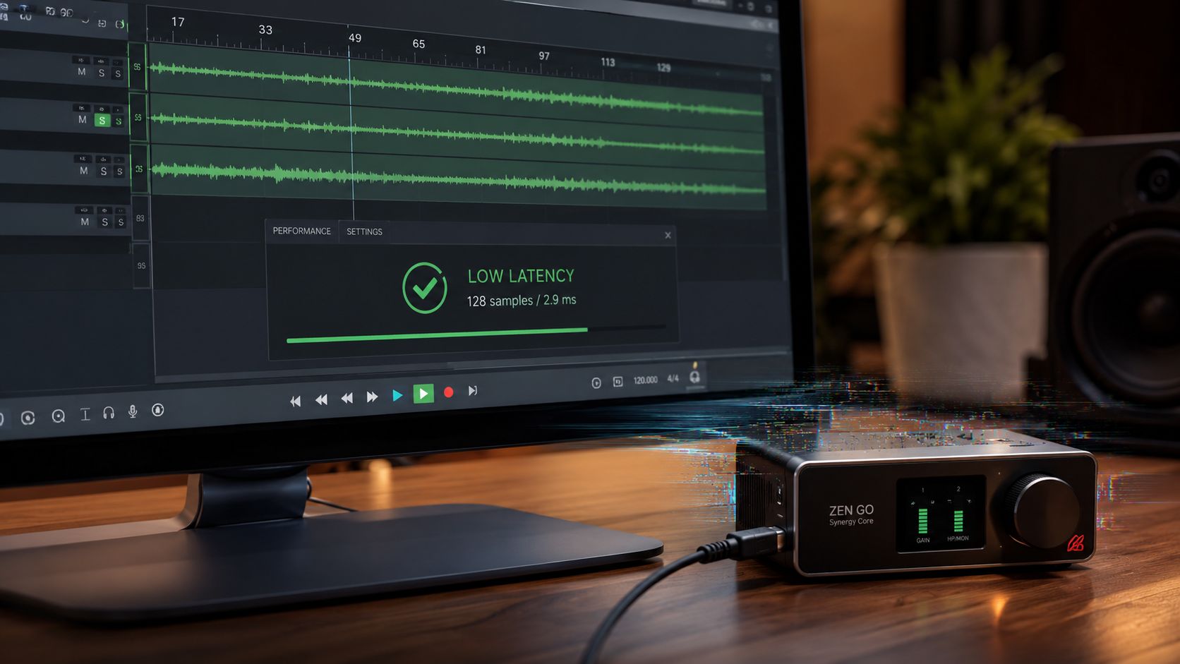 A professional audio interface Zen Go Synergy Core connected to a computer showing digital audio software.