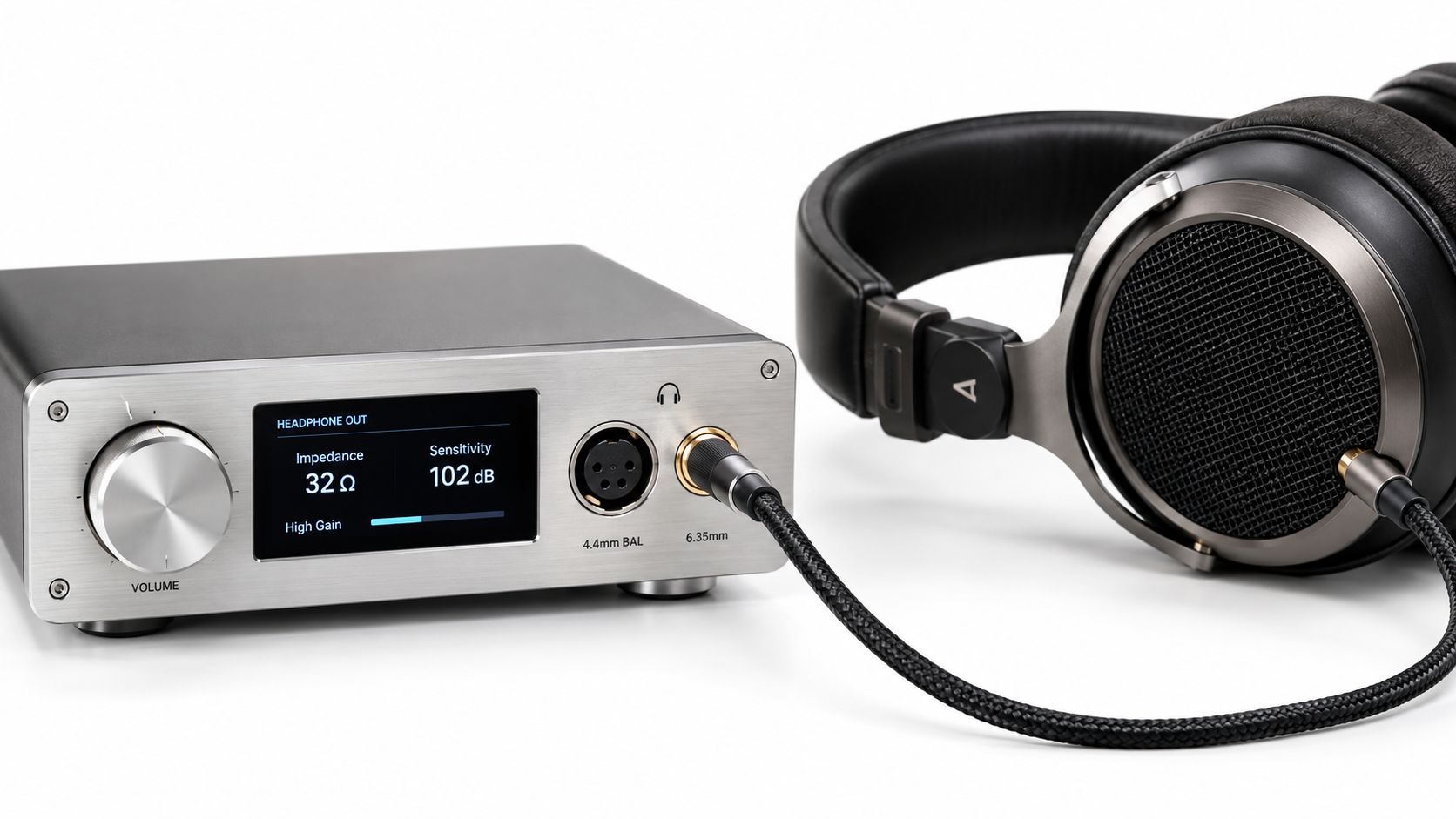 A premium desktop headphone amplifier with a digital display screen connected to high-end over-ear wired headphones.